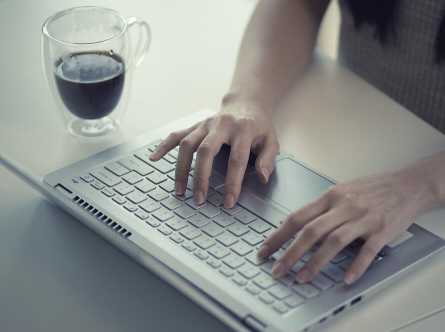 employee typing on keyboard